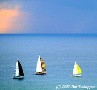 Colorful Sailboats at Dusk