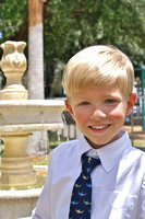 Trey next to fountain after VPK graduation